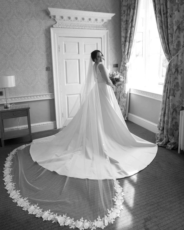 Photo of Bianco Single Tier Cut Edge Cathedral Veil with Sequinned Floral Lace Train S342 uploaded by S on 21st October 2024