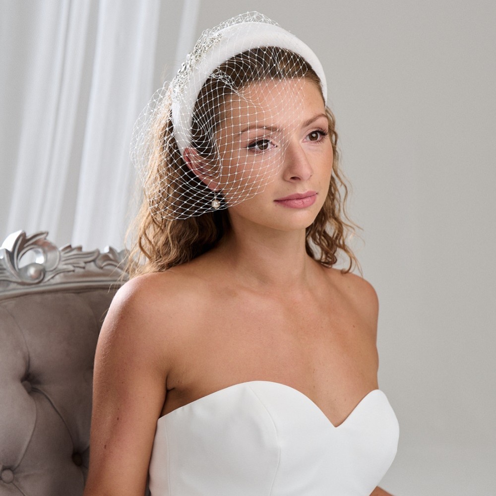 Photograph: Arianna Ivory Crystal Embellished Headband with Birdcage Veil AR795