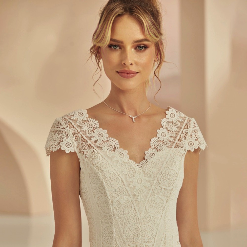 Photograph of Bianco Ivory Floral Lace Bridal Bolero with Cap Sleeves E364