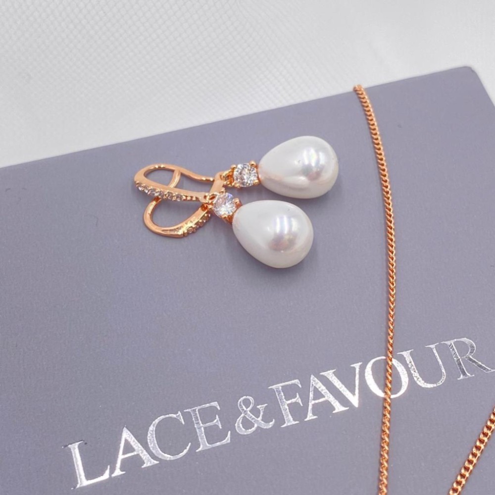 Photograph of Dolci Rose Gold Crystal Embellished Teardrop Pearl Earrings