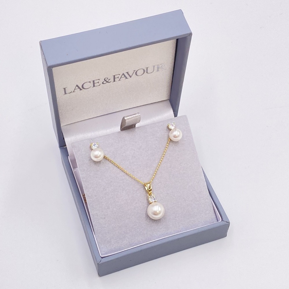 Photograph of Evie Gold Dainty Pearl Stud Earring and Pendant Jewellery Set