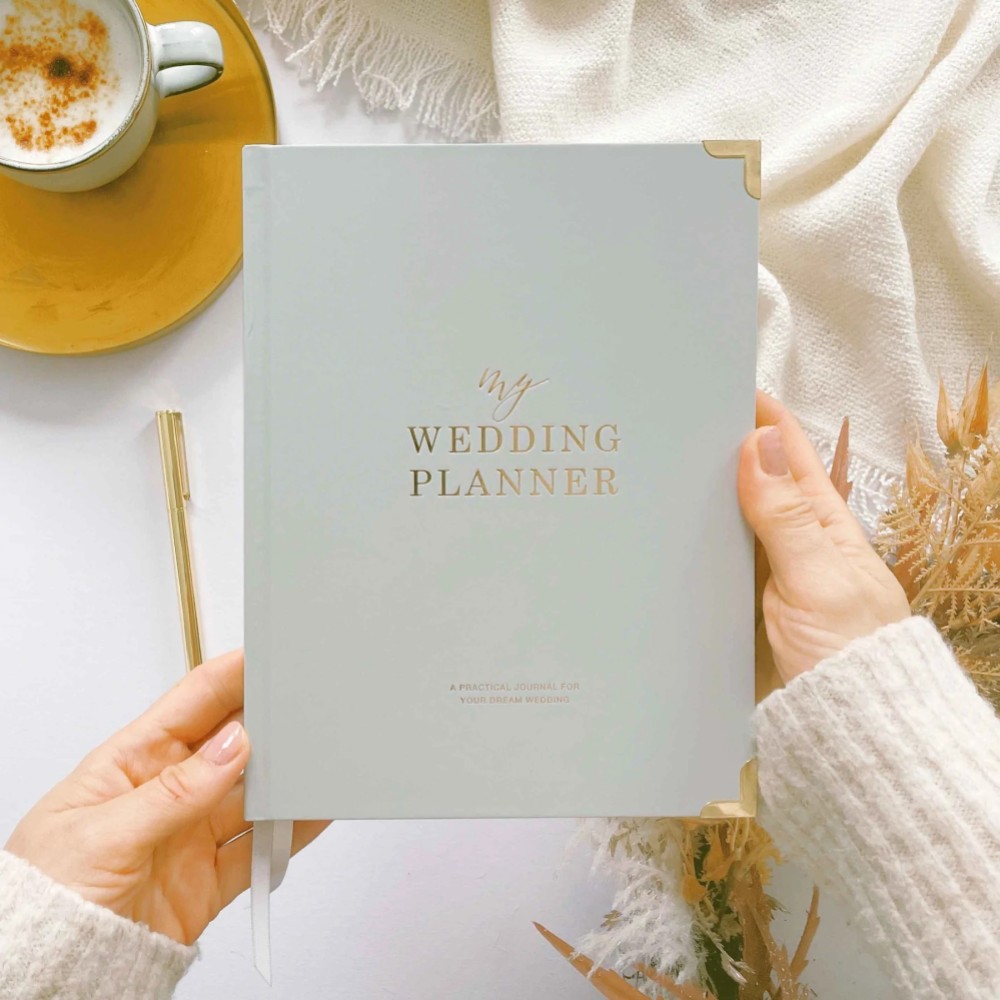 Photograph of Grey and Gold Luxury Wedding Planner Book with Gilded Edges