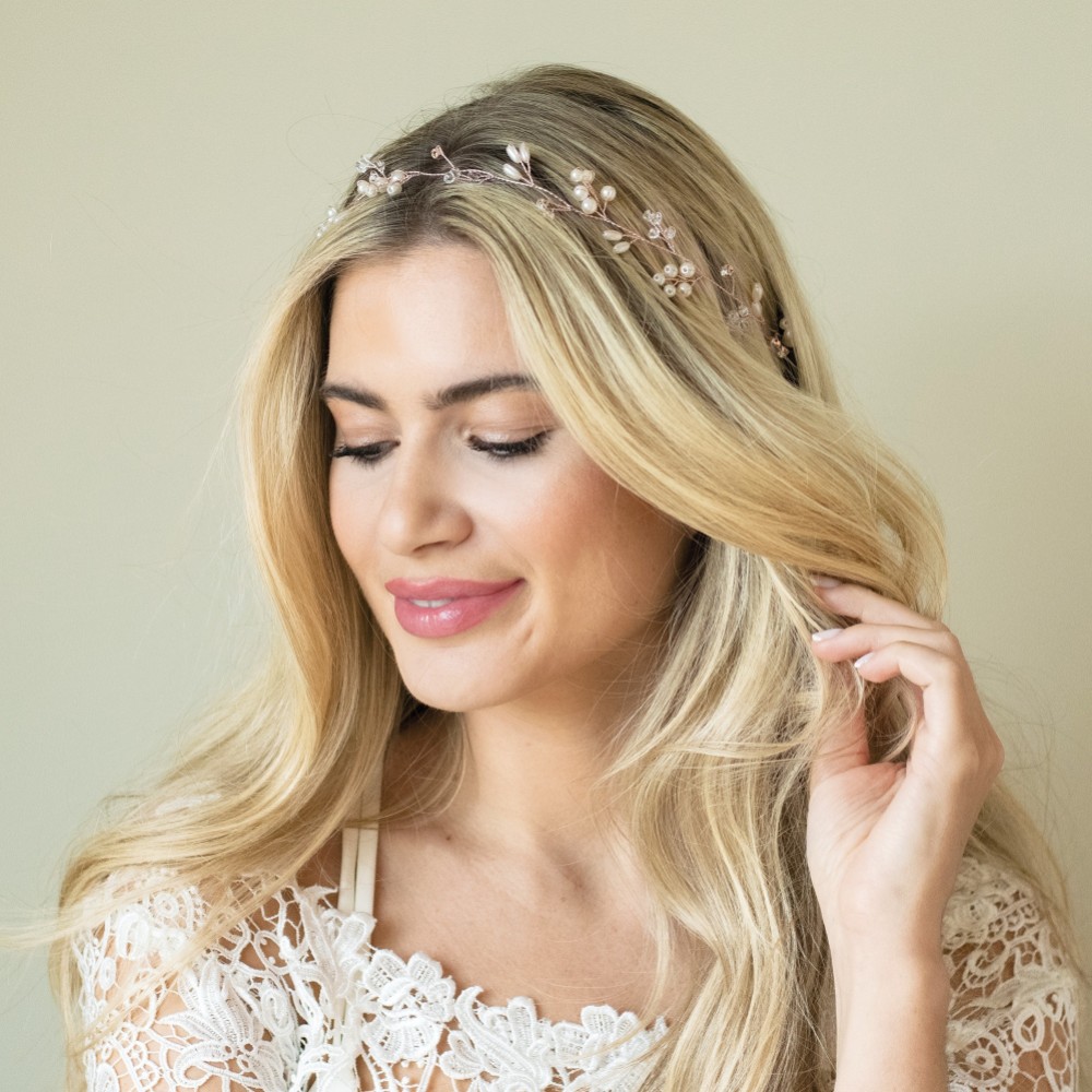 Photograph of Ivory and Co Aurora Rose Gold Dainty Pearl and Crystal Hair Vine