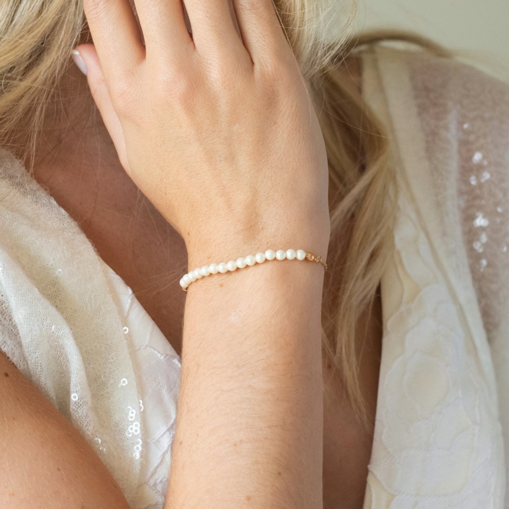 Photograph of Ivory and Co Carlisle Gold Pearl Toggle Bracelet