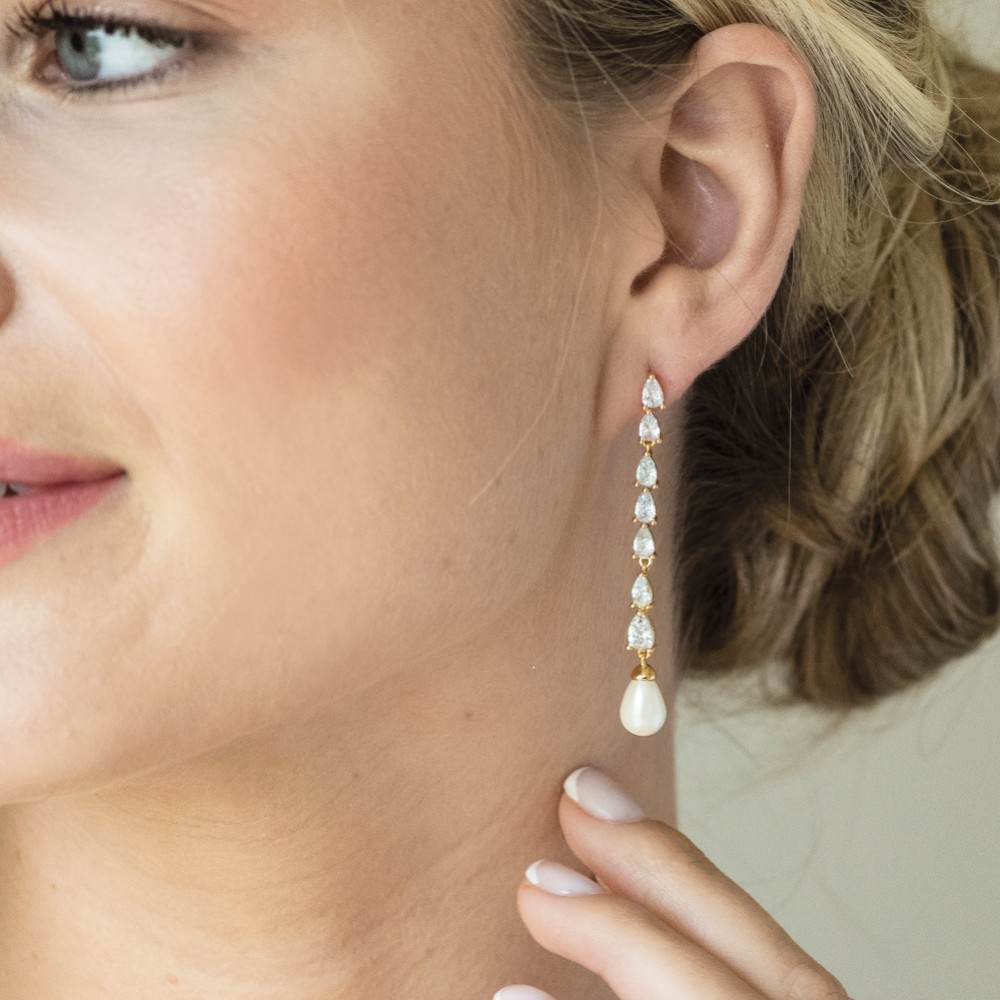 Photograph of Ivory and Co Melbourne Gold Crystal Long Pearl Drop Earrings