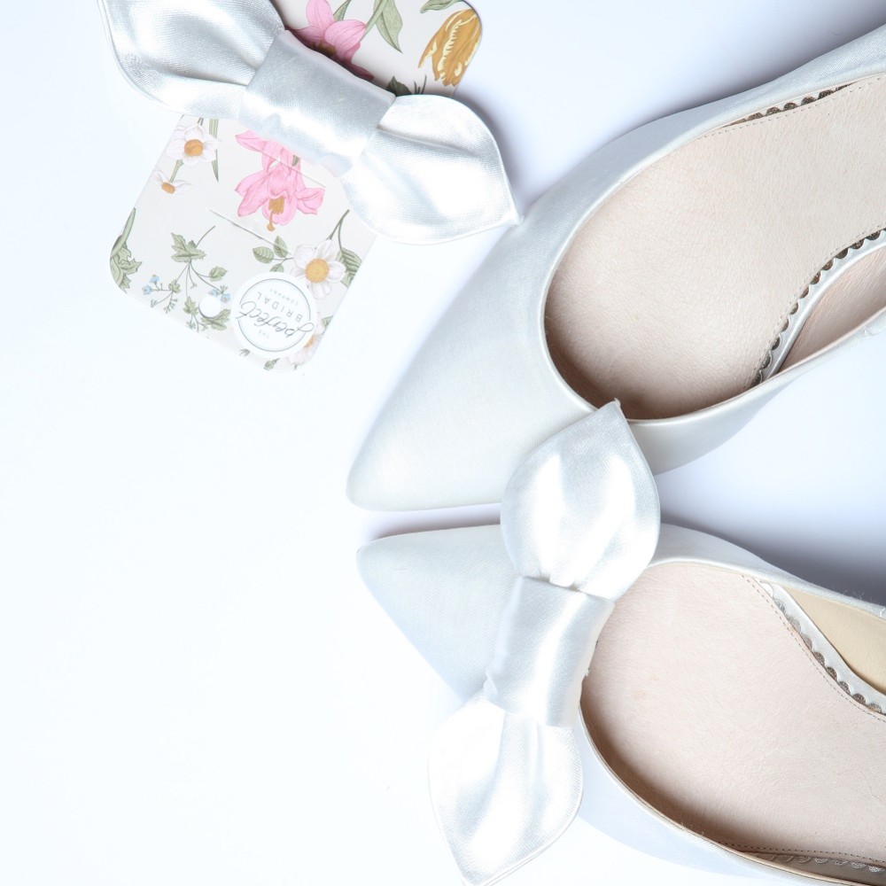 Photograph of Perfect Bridal Fig Ivory Satin Bow Shoe Clips