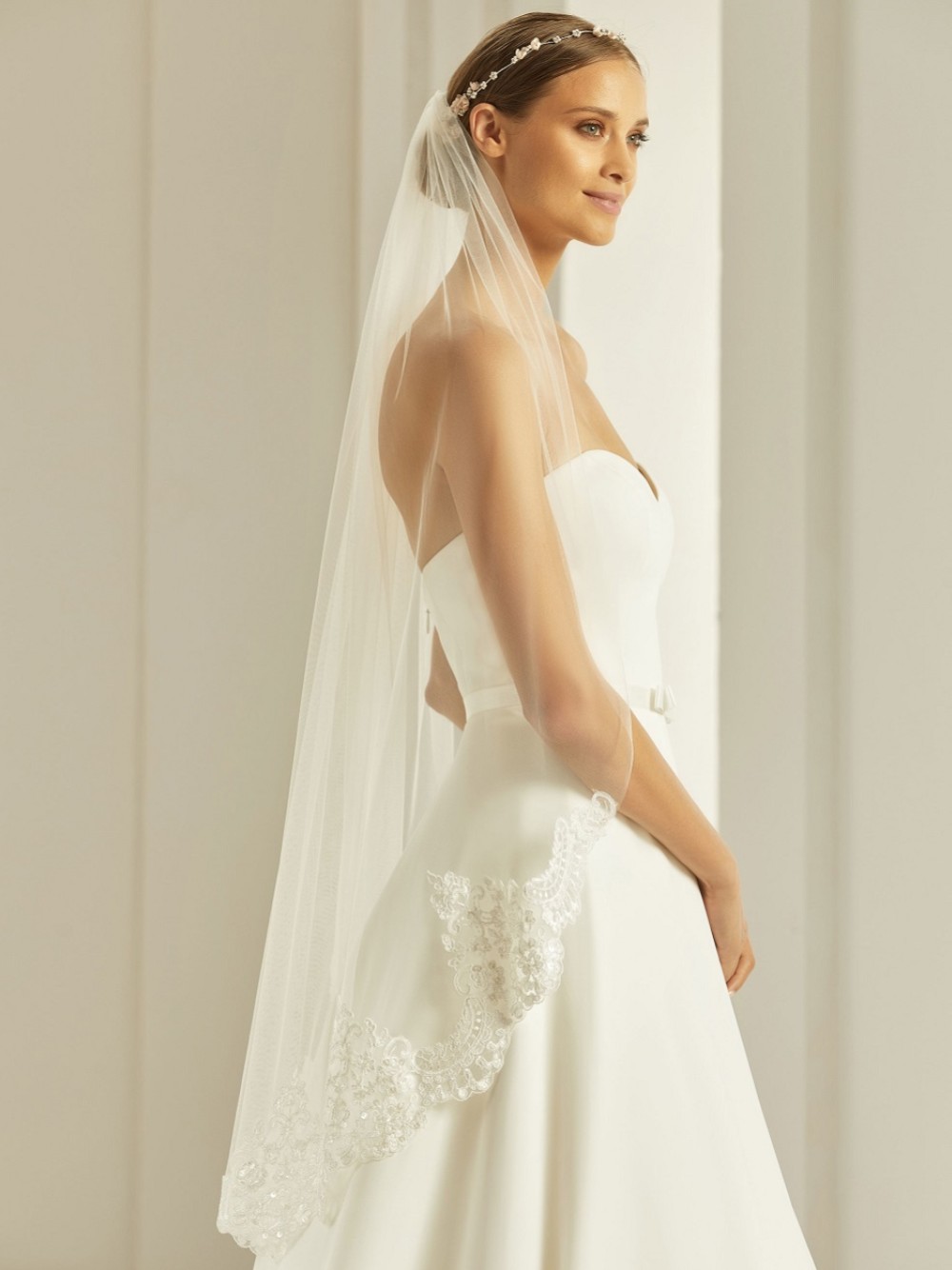 Photograph of Bianco Ivory Single Tier Fingertip Veil with Beaded Lace Edge S286