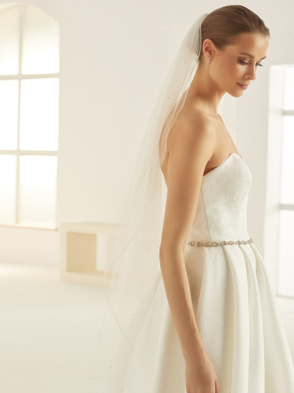 Photograph: Bianco Ivory Single Tier Swarovski Crystal Fingertip Veil with Corded Edge S320