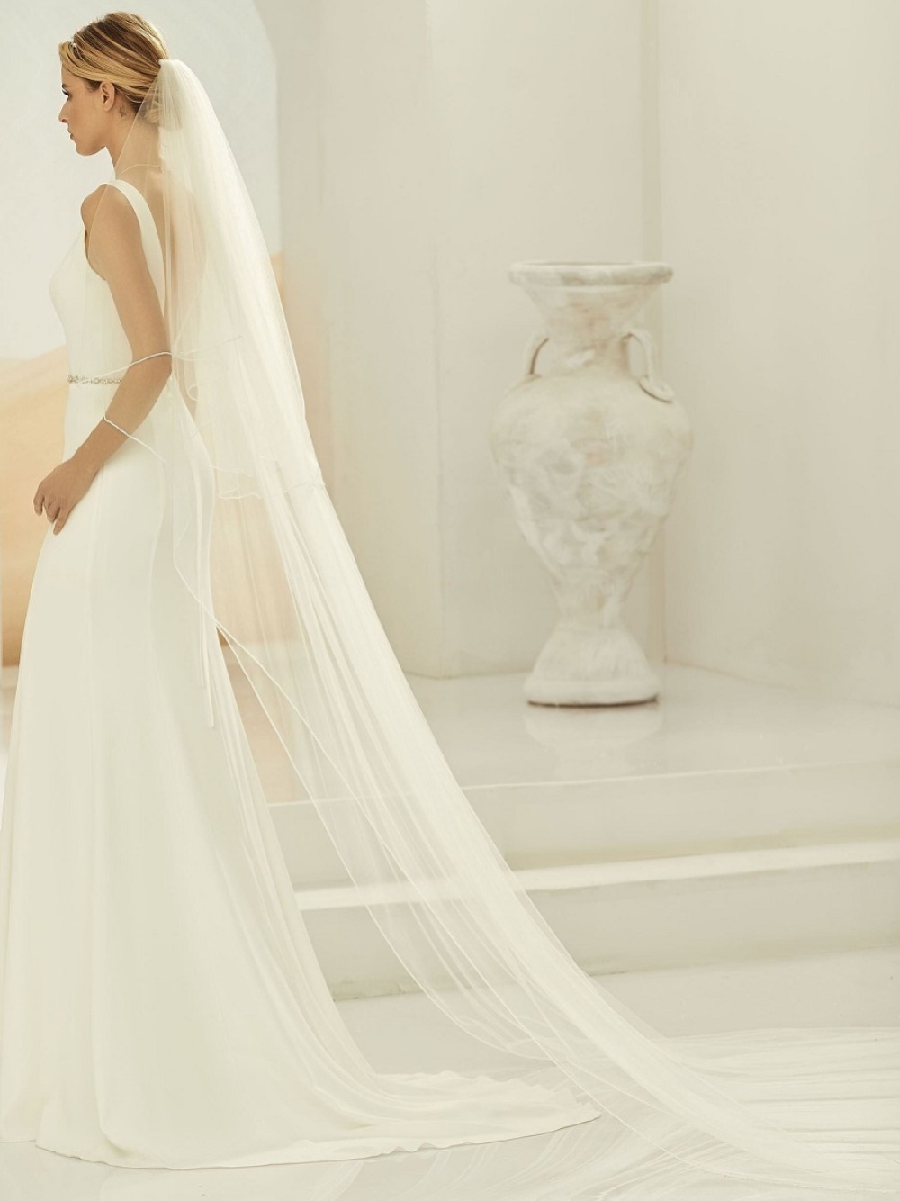 Photograph of Bianco Ivory Two Tier Beaded Edge Cathedral Veil S397
