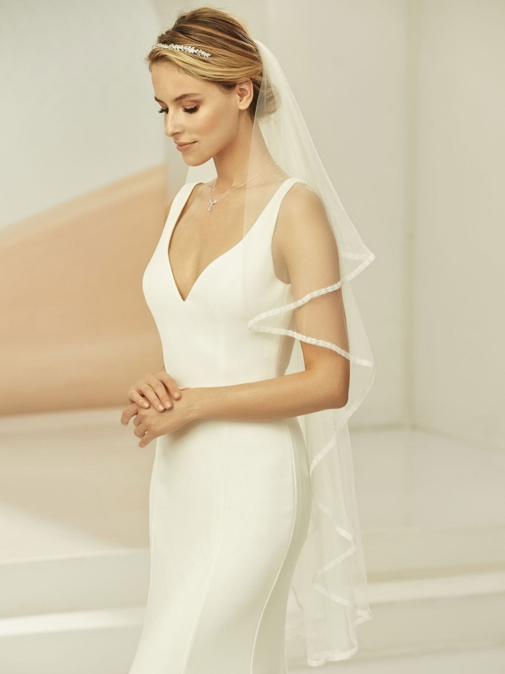 Photograph: Bianco Ivory Waterfall Effect Fingertip Veil with Narrow Lace Edge S365