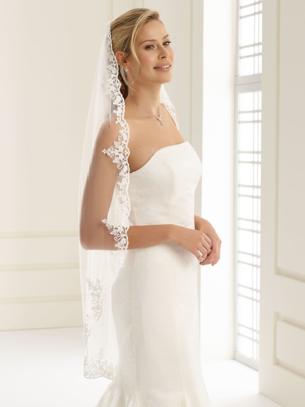 Photograph of Bianco Single Tier Delicate Beaded Lace Edge Fingertip Veil S192