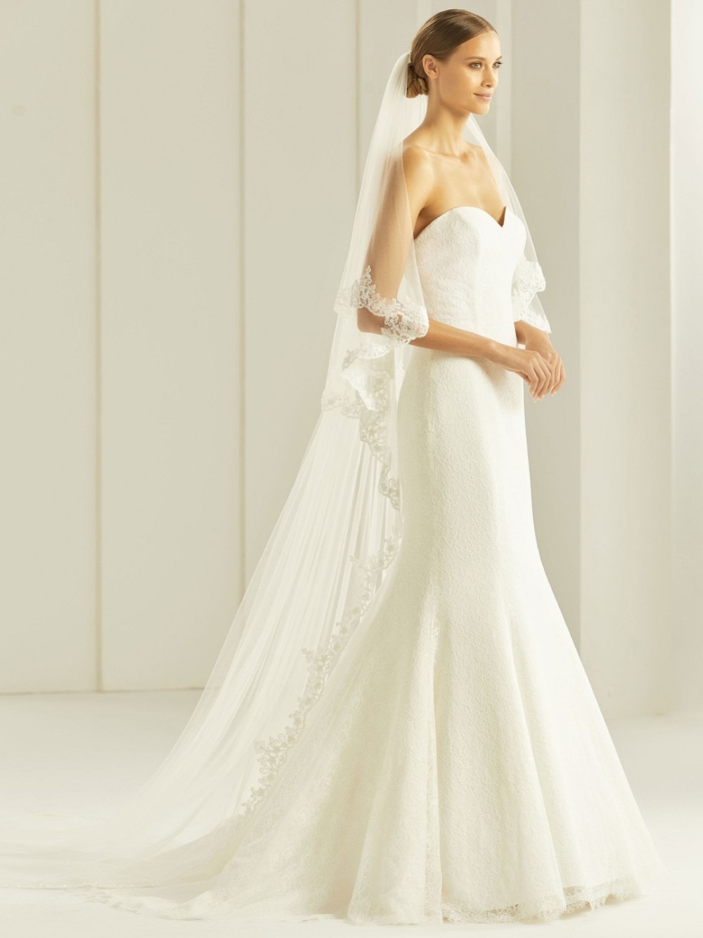 Photograph: Bianco Two Tier Delicate Beaded Lace Edge Cathedral Veil S258
