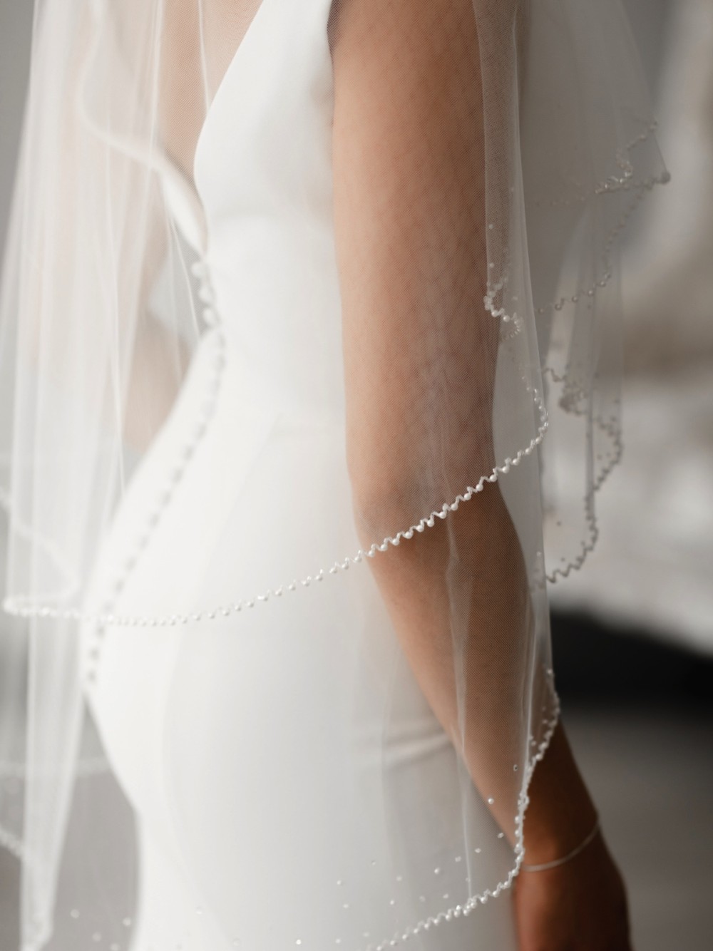 Photograph of Linzi Jay Two Tier Pearl Edge Ivory Tulle Fingertip Veil V684