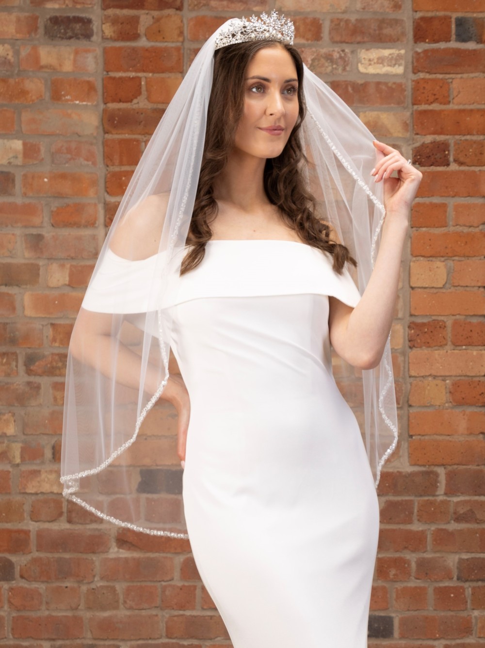 Photograph of Perfect Bridal Ivory Single Tier Silver Beaded Edge Fingertip Veil
