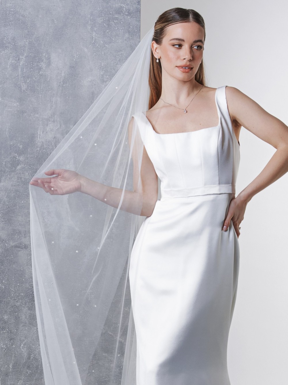 Photograph of Rainbow Club Avalanche Ivory Scattered Pearl Long Veil