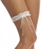 Photograph: Bianco Narrow Ivory Lace Wedding Garter with Diamante Bow