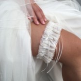 Photograph: Chantilly Ivory Floral Lace Bridal Garter with Pearl Droplet