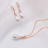 Photograph: Dolci Rose Gold Crystal and Teardrop Pearl Bridal Jewellery Set