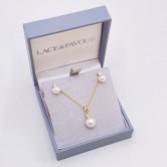 Photograph: Evie Gold Dainty Pearl Stud Earring and Pendant Jewelry Set
