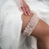 Photograph: Jarretière de mariage vintage en dentelle nude Serenity avec bordure de perles