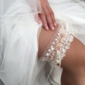 Photograph: Rhapsody Blush Silk and Ivory Tulle Vintage Lace Garter with Rose Detail (jarretière en soie et tulle ivoire avec détails de roses)