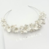 Photograph: Trinity Ivory Ceramic Flower and Pearl Wedding Headband