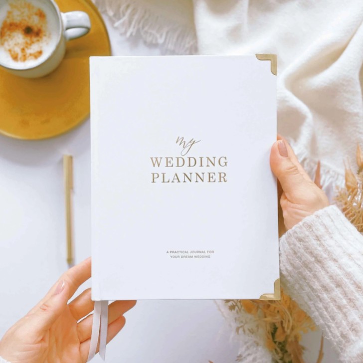 Libro planner per matrimoni di lusso bianco e oro con bordi dorati