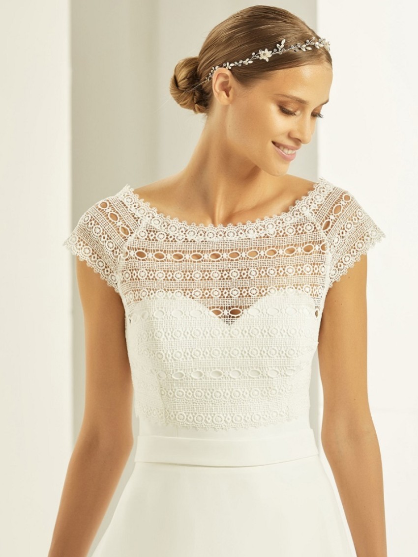 Photograph: Bianco Ivory Boho Lace Short Sleeve Wedding Bolero E278