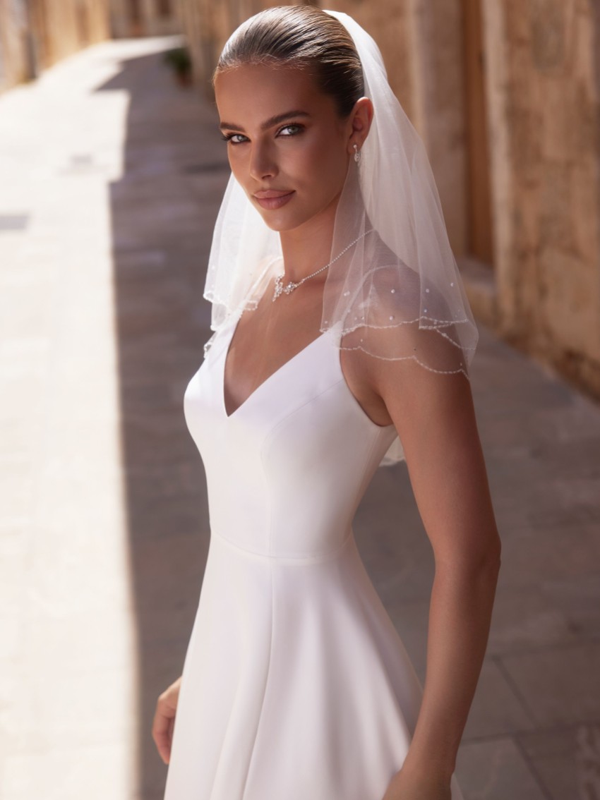 Photograph: Bianco Ivory Two Tier Scalloped Beaded Edge Short Veil S523