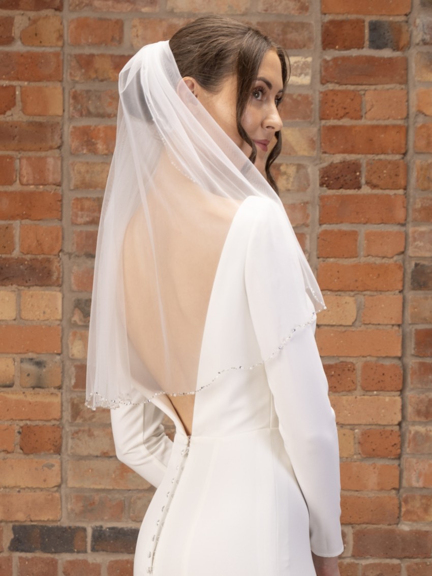 Photograph: Perfect Bridal Ivory Single Tier Pearl and Diamante Edge Short Veil