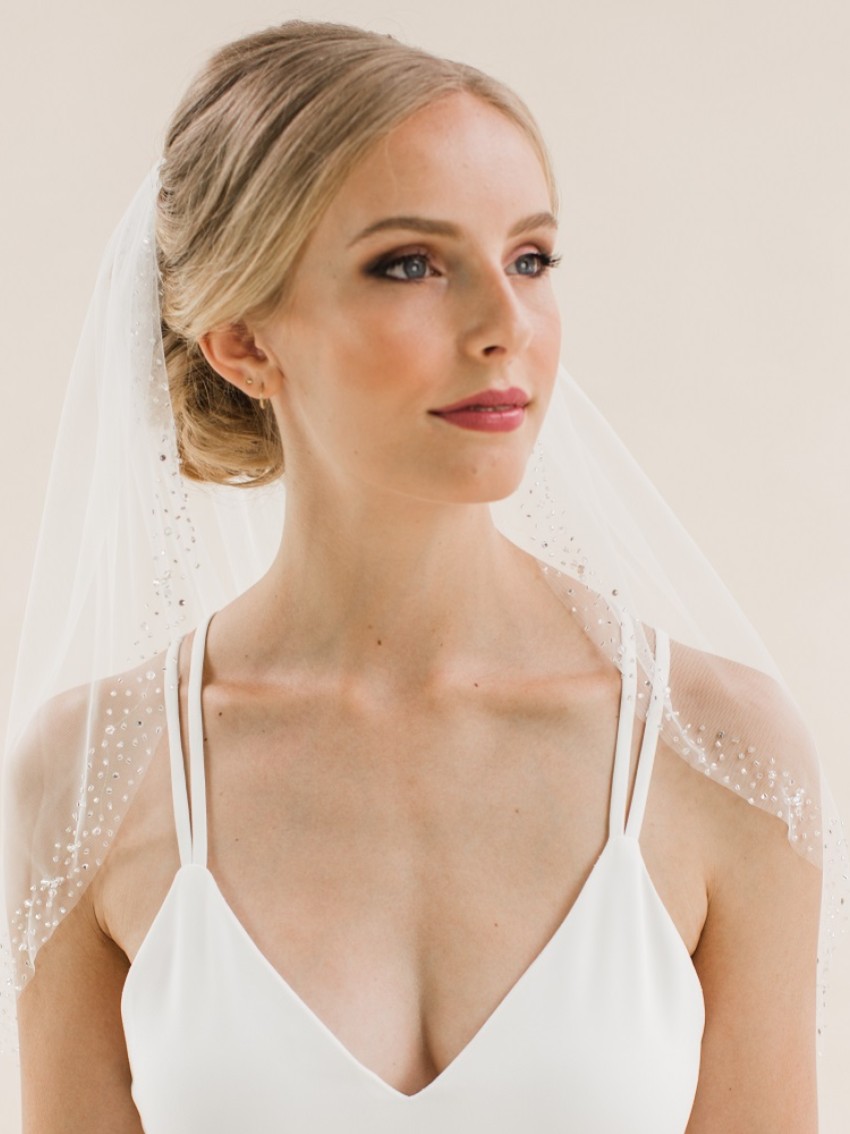 Photograph: Rainbow Club Foxglove Ivory Crystal and Beaded Edge Waist Length Veil