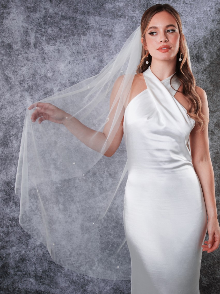 Photograph: Rainbow Club Leilani Ivory Single Tier Scattered Pearl Fingertip Veil