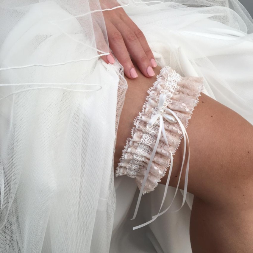 Photograph: Chantilly Blush Floral Lace Bridal Garter with Pearl Droplet