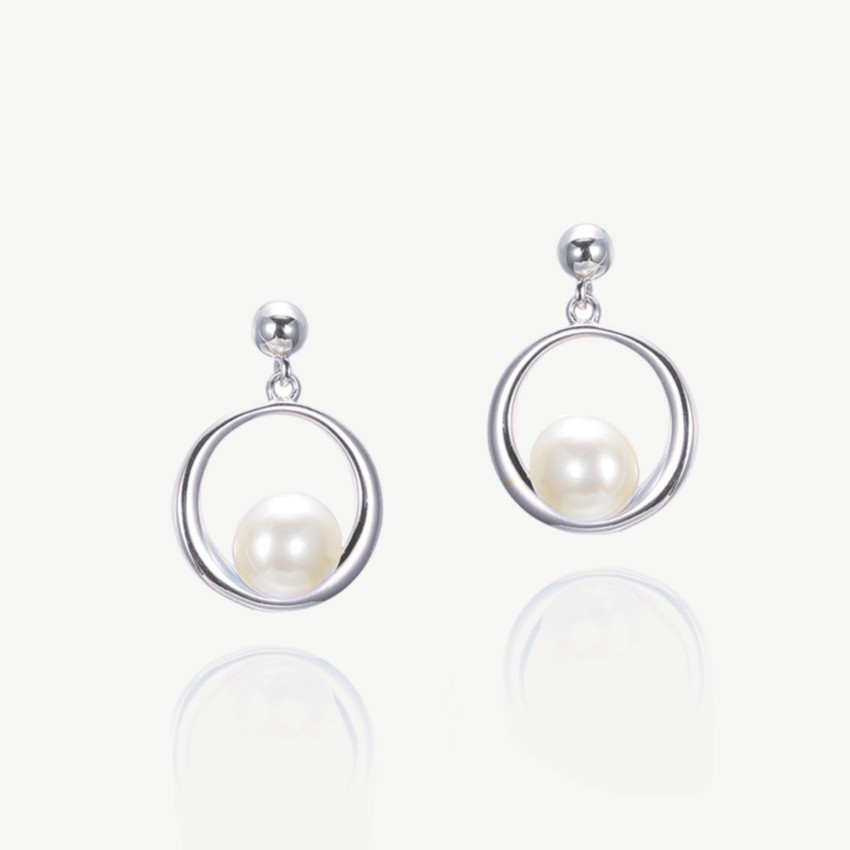 Photograph: Ivory and Co Memphis Silver Hanging Pearl Earrings